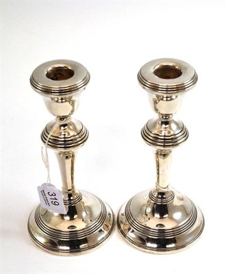 Lot 319 - A pair of George VI silver candlesticks on circular bases, Birmingham, 1941, 18cm high