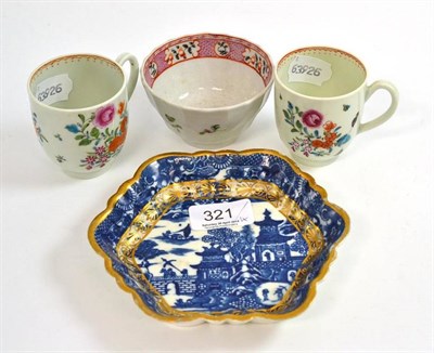 Lot 321 - Two Worcester coffee cups painted with flowers, a Caughley blue printed hexagonal tea pot stand and