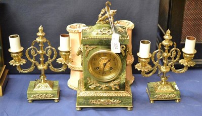 Lot 324 - A green marble and gilt metal striking mantel clock with garniture, circa 1910, floral and...