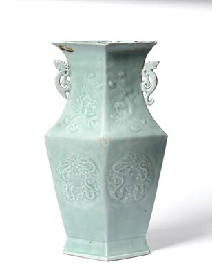 Lot 327 - A Chinese celadon glazed lozenge section vase, decorated with four circular panels of dragons...