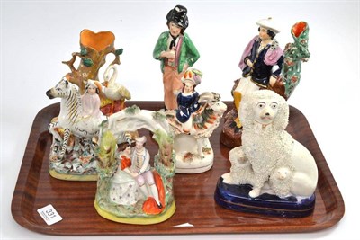 Lot 331 - Seven assorted Staffordshire figures including Arbour group, Poodle dog etc