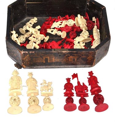 Lot 339 - A Cantonese ivory stained and natural ivory chess pieces in a Chinese lacquer hinged box, the chess