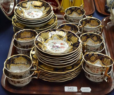 Lot 342 - A Ridgeways porcelain tea and coffee service, with foliate decoration on a blue ecru and gilt...