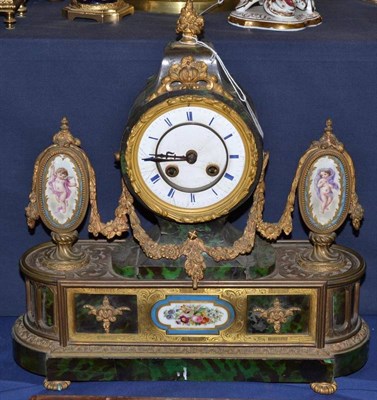 Lot 344 - A faux tortoiseshell gilt metal porcelain mounted striking mantel clock, circa 1890, floral...