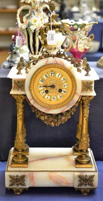 Lot 346 - An onyx and gilt metal mounted striking mantel clock, circa 1900, 56cm high