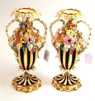 Lot 351 - A pair of mid 19th century Staffordshire porcelain flower encrusted vases, 27cm high