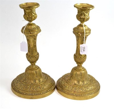 Lot 354 - Pair of 19th century brass candlesticks, 32cm high