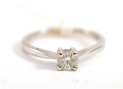 Lot 363 - A diamond solitaire ring, the round brilliant cut diamond in a white four claw setting, to a...