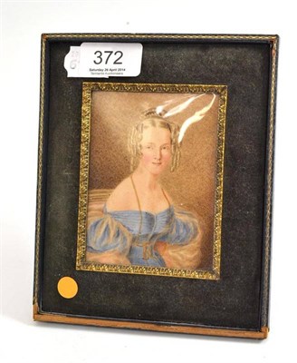 Lot 372 - ^ A 19th century English School miniature portrait of a girl wearing a blue dress with her hair...