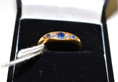 Lot 380 - A sapphire and diamond five stone ring, set with graduated old cut alternating stones, in a...