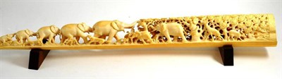 Lot 423 - An early 20th century carved ivory elephant bridge, 64cm long