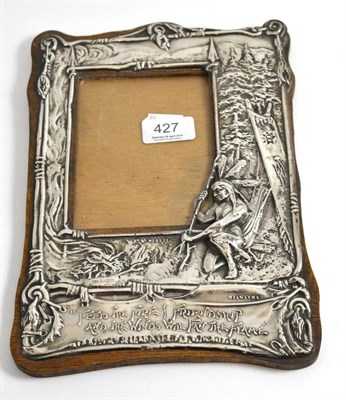 Lot 427 - An Arts & Crafts silver photograph frame, Charles Cooke, Chester 1904, decorated in repoussé...