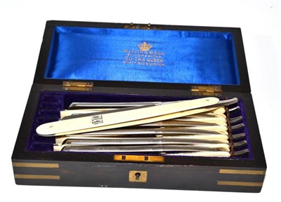 Lot 456 - A set of seven cut throat razors by Mappin & Webb, the back edges engraved for each day of the...