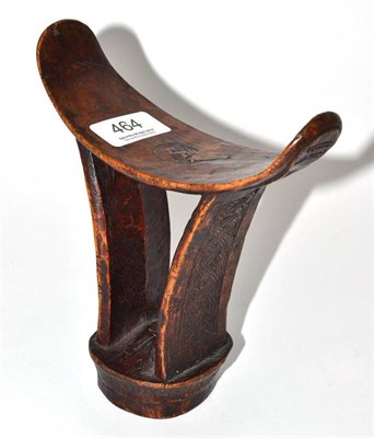 Lot 464 - A Boni, Somalia headrest, the dished top on curved struts intricately carved with an interlaced...