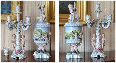 Lot 467 - A pair of Capodimonte style urns and covers, 38cm high; and a similar pair of candelabra