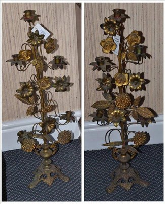 Lot 473 - A pair of painted and gilt metal foliate candelabra, 79cm high