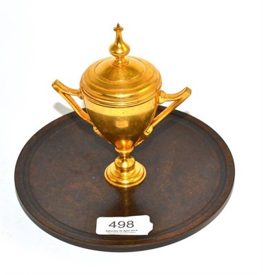 Lot 498 - A patinated and gilt bronze inkwell in the form of a trophy cup, 16cm high