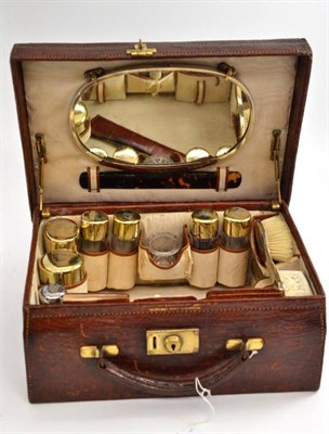 Lot 513 - Silver gilt dressing table set, London 1903