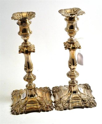 Lot 536 - A pair of modern silver candlesticks in the Victorian style, Birmingham 1968, with square bases...