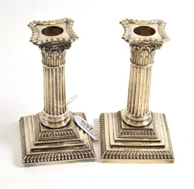 Lot 537 - Pair of silver Corinthian column candlesticks, Sheffield 1887, 16cm high