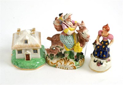 Lot 548 - Staffordshire figure of lady carrying children on a goat (a.f.); Staffordshire candle...