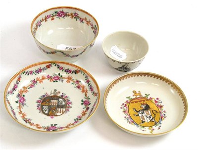 Lot 557 - A Chinese armorial slop bowl, Qianlong, 11cm diameter; a matching saucer; a similar saucer; and...