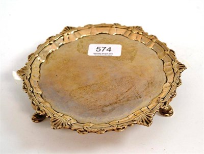 Lot 574 - George III waiter, with engraved crest, unmarked, 18.5cm diameter