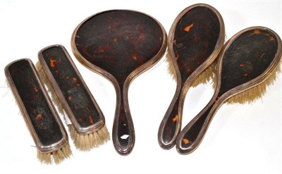 Lot 584 - ^ A George V five piece silver mounted tortoiseshell dressing table set, Birmingham 1926