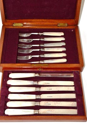 Lot 586 - ^ A cased set of six silver Edwardian fruit knives and forks, with mother-of-pearl handles,...