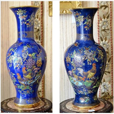 Lot 620 - A pair of Carltonware blue ground shouldered ovoid vases with trumpet necks, decorated in the...