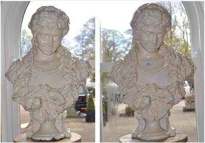 Lot 621 - A pair of Continental cream painted metal busts of girls in lace dresses, 64cm high