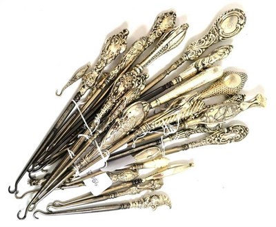 Lot 641 - Twenty seven silver and steel button hooks