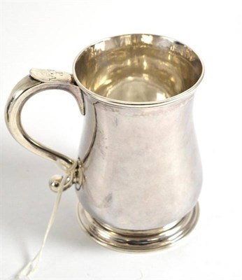 Lot 644 - A George II silver mug, Isaac Cookson, Newcastle 1746, of baluster form with inverted S scroll...