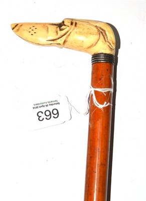 Lot 663 - A 19th century walking stick with a dog's head handle (glass eyes missing), 89.5cm high