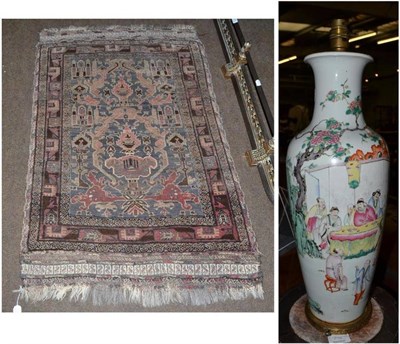 Lot 677 - A 19th century Chinese vase (converted to a lamp) and a Belouch prayer rug (2)