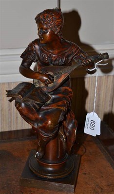 Lot 680 - An Art Nouveau bronze figure playing a mandolin, 32cm high