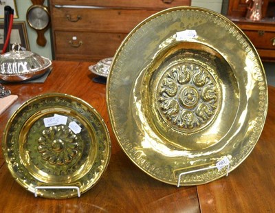 Lot 683 - # A brass Alms dish, in 17th century style, circular, with oak leaf punched rim and central...