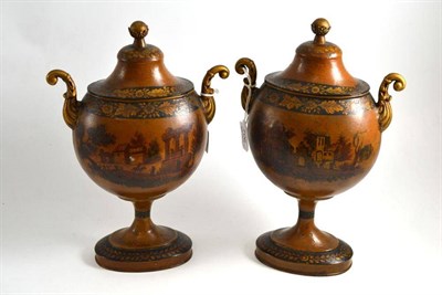 Lot 706 - A pair of George III Pontypool toleware chestnut urns and covers, of flattened ovoid form with ball