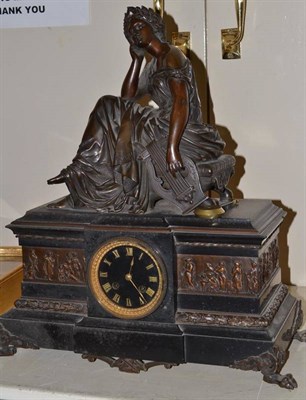 Lot 721 - A black slate and bronze mounted figural striking mantel clock, retailed by Elkington & Co,...