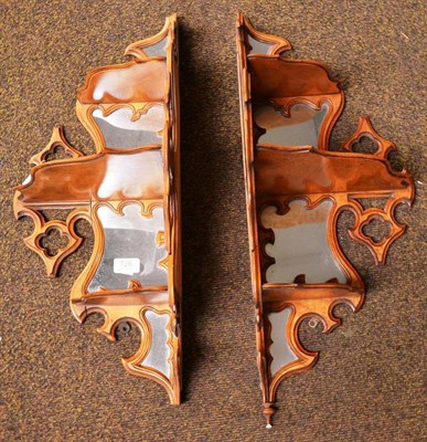 Lot 726 - A pair of Victorian Gothic revival bird's eye maple three-tier corner brackets, late 19th...