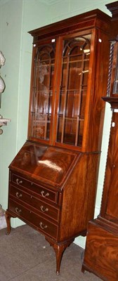 Lot 737 - A 1920's mahogany bureau bookcase