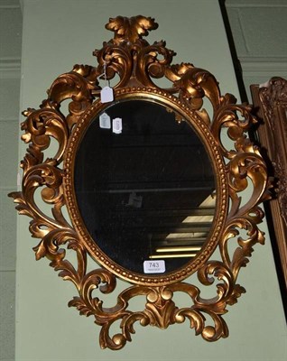 Lot 743 - An Italian carved and gilt oval mirror