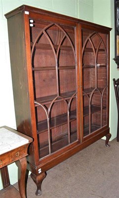 Lot 751 - Georgian mahogany glazed bookcase on later stand