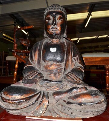 Lot 758 - A 19th century carved figure of a seated Buddha, 70cm high