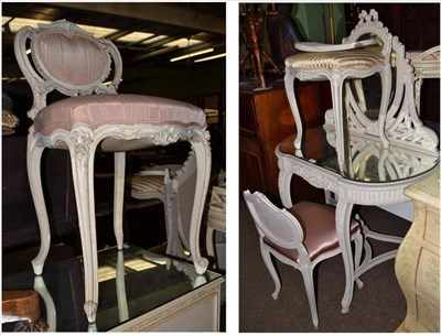 Lot 760 - Cream painted dressing table with plate glass top and three cane back dressing stools (a.f.)