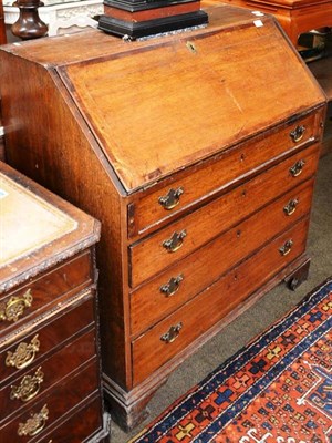 Lot 780 - Georgian crossbanded oak bureau