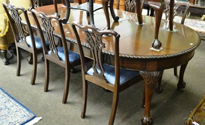 Lot 787 - Chippendale style mahogany dining table with two extra leaves and eight chairs (including two...