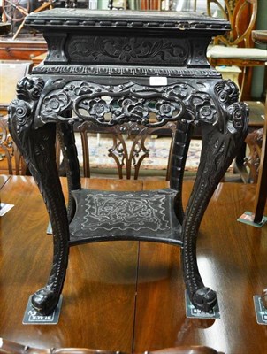 Lot 788 - Early 20th century Chinese carved plant stand decorated with prunus, 76cm high