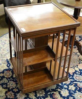 Lot 795 - An Edwardian oak revolving bookcase, by James Schoolbred & Co, labelled, 54cm square, 81.5cm