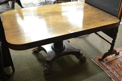 Lot 797 - William IV rectangular rosewood breakfast table, raised on claw feet, 145cm diameter